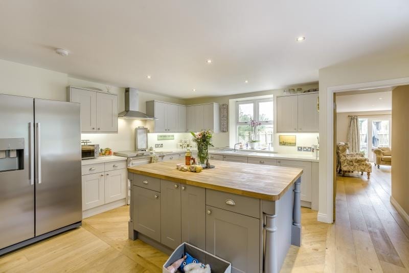 The farmhouse kitchen with rustic wooden table