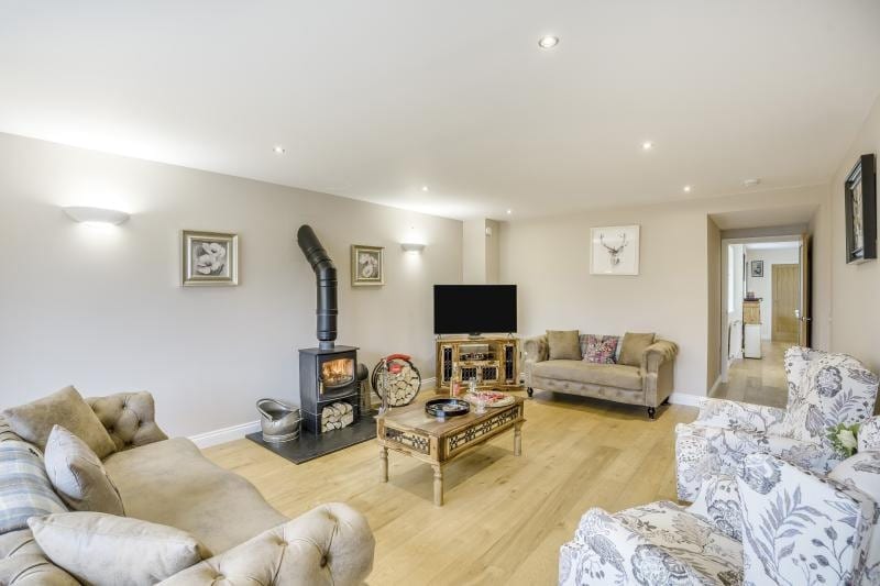 The cosy living room with log-burning stove